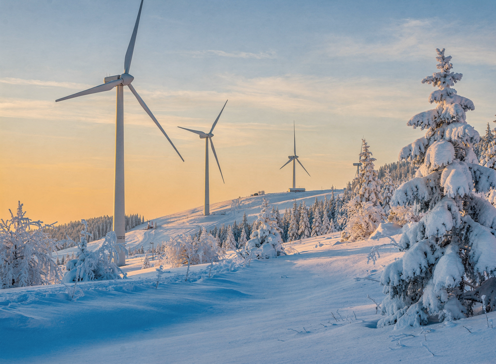 Wind turbines in snowy Canadian mountain landscape — Cumulo Analytics wind energy consulting